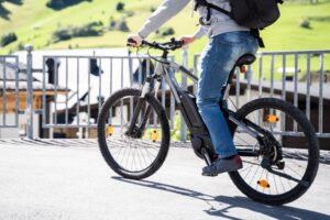 man riding ebike in city
