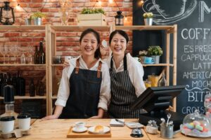 small startup business owner concept two successful young baristas